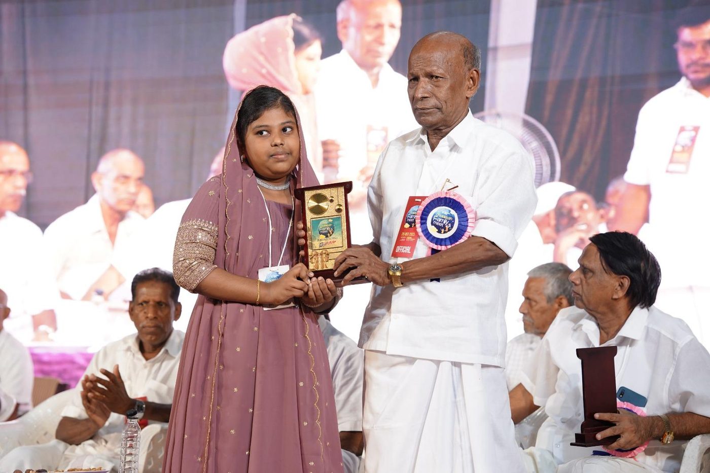 Awards & Recognition · Young participant receiving recognition